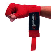 Red Rewon hand wraps for boxing, providing wrist support and protection. Ideal for boxing gloves, fitness, and martial arts training.